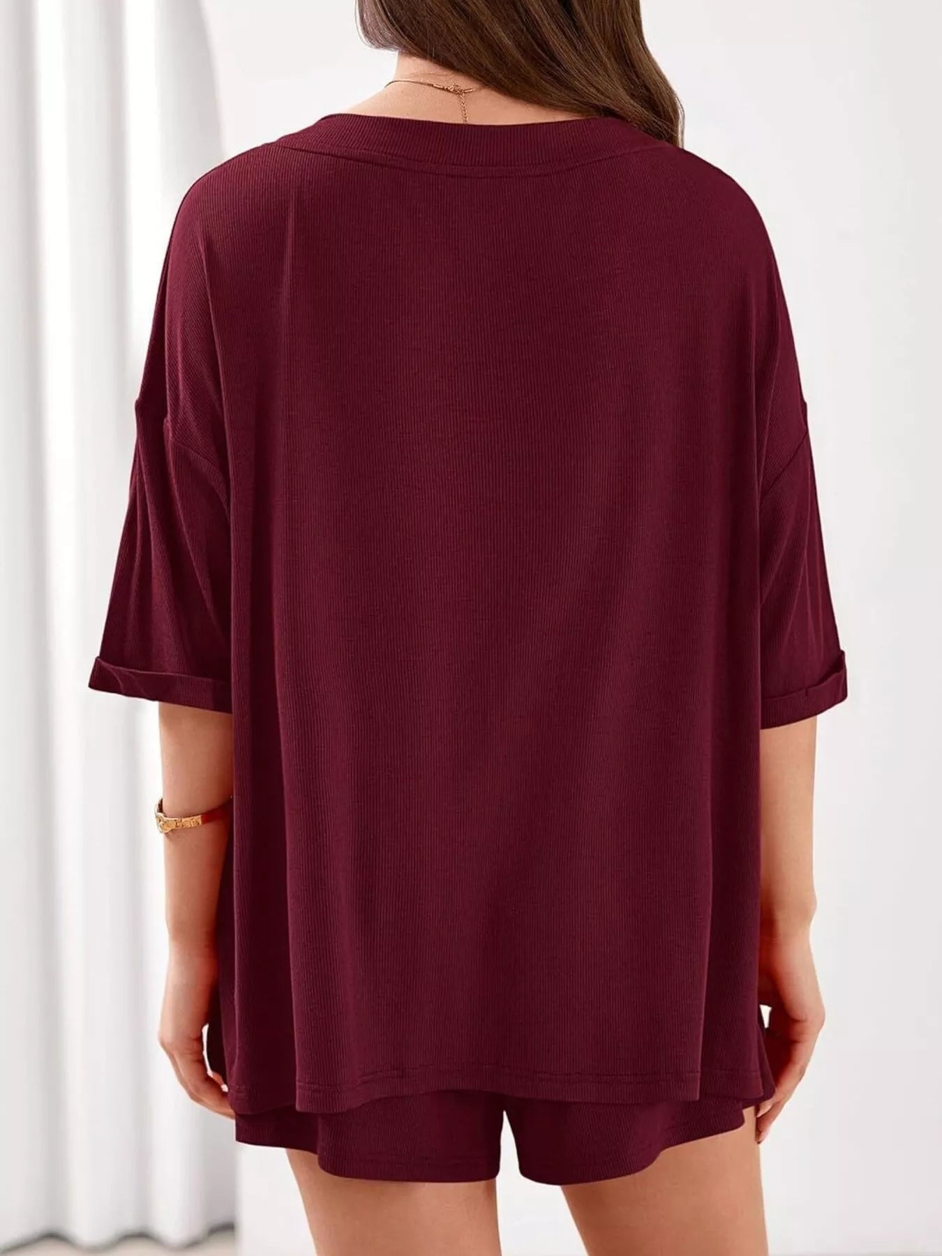 Women's casual V-neck top and shorts set in solid color, trendy two-piece outfit perfect for everyday wear.