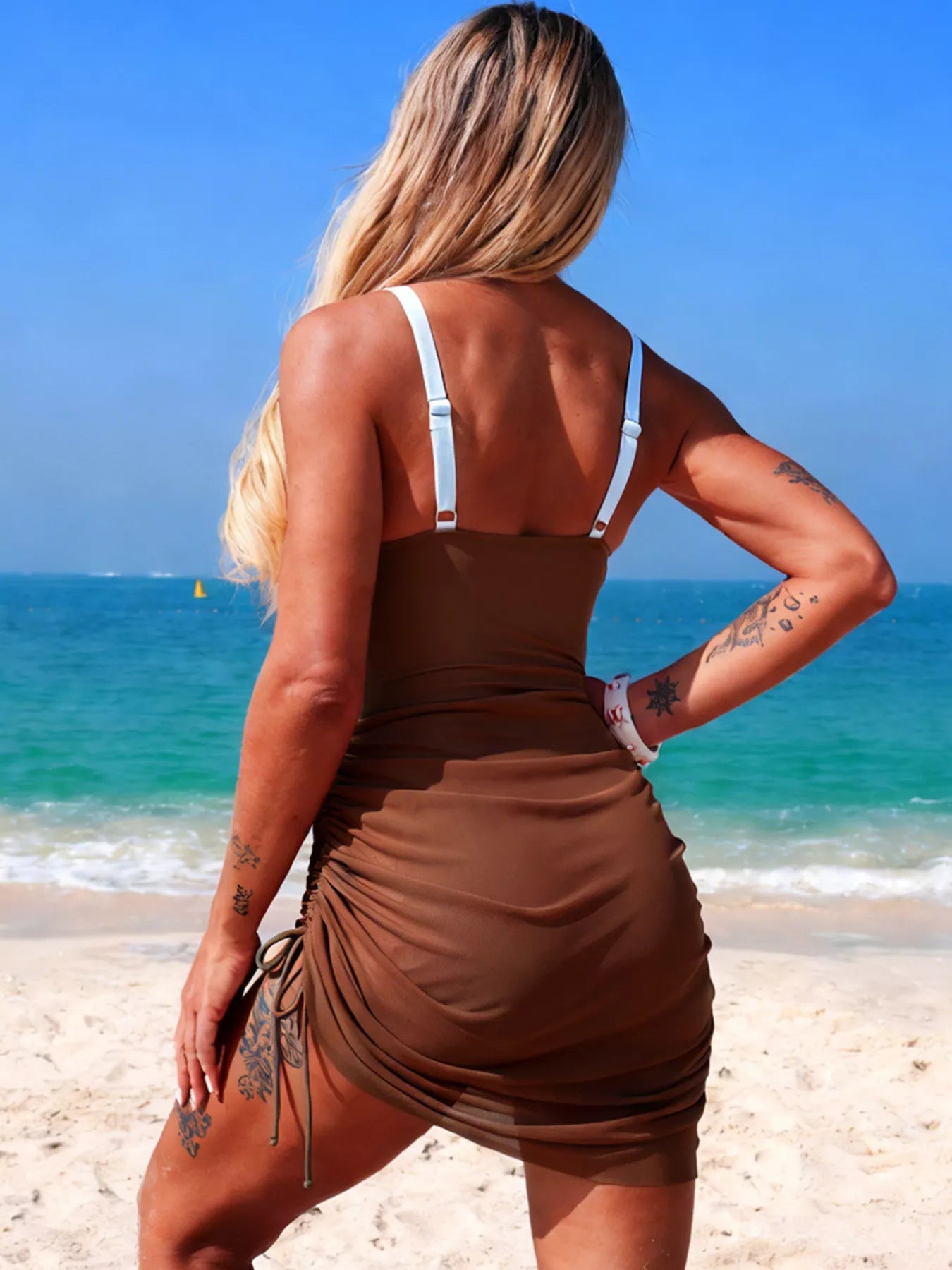 Women's color block cutout one-piece swimsuit by Trendsi, featuring stylish design and vibrant beachwear perfect for summer.