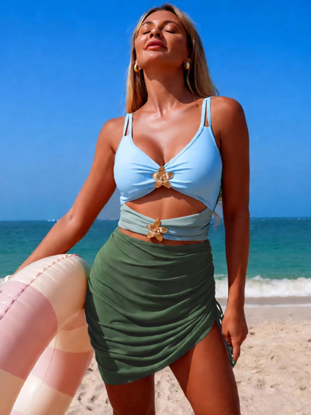 Women's color block cutout one-piece swimsuit by Trendsi, stylish beachwear with vibrant color blocking and flattering cutouts.
