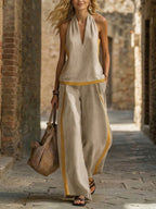 Women’s contrast color sleeveless vest and wide-leg pants set, casualwear by Plush Fashion Hub, shown in a stylish outdoor setting.