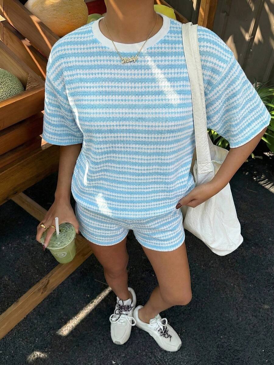 Women's crew-neck spliced casual T-shirt and shorts set by Plush Fashion Hub, featuring short sleeves and a stylish design.