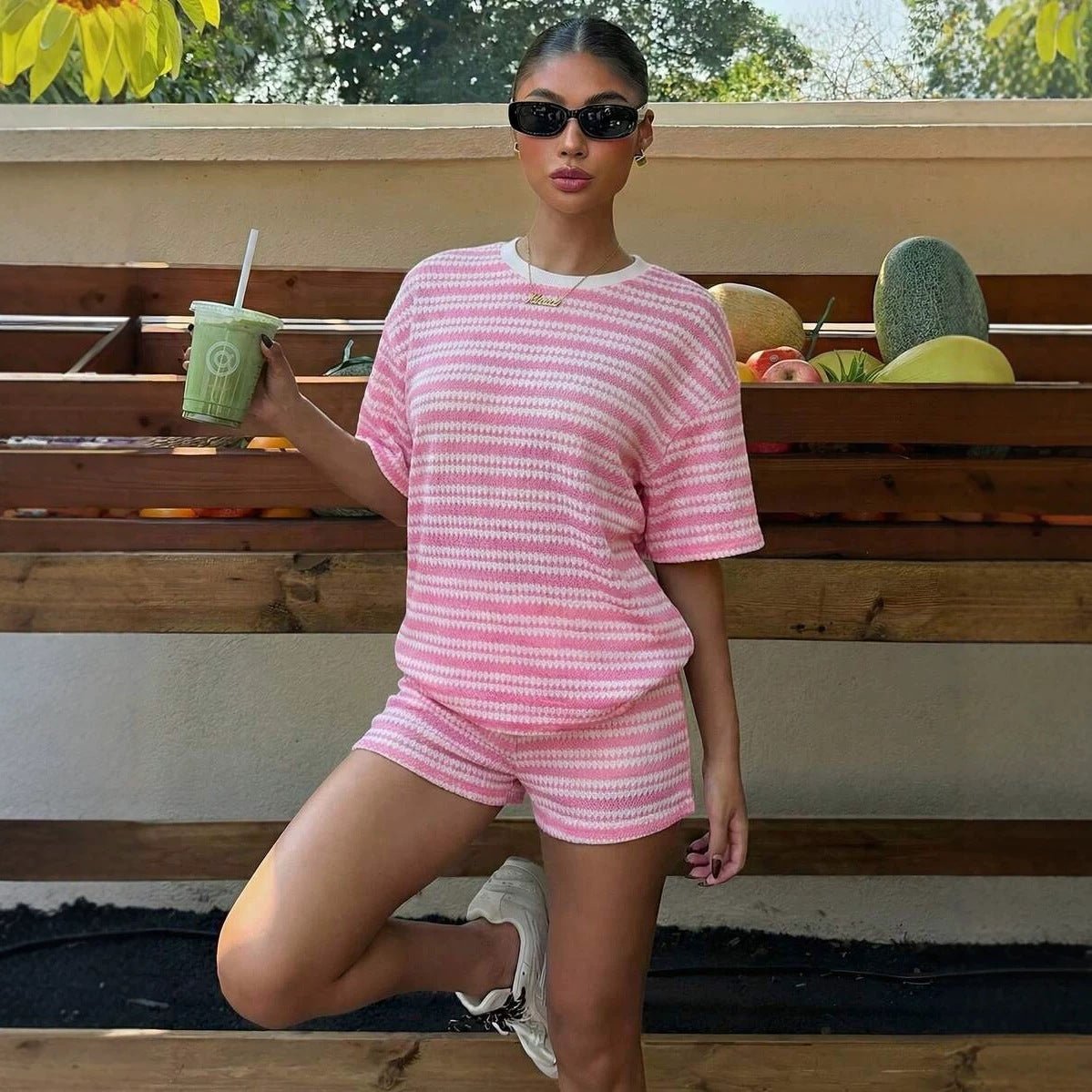 Women's casual crew-neck spliced short-sleeve T-shirt and shorts set by Plush Fashion Hub, displayed on a model.