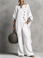 Women's casual drop shoulder three-quarter sleeve irregular shirt and pants set by Plush Fashion Hub, shown in a relaxed fit.