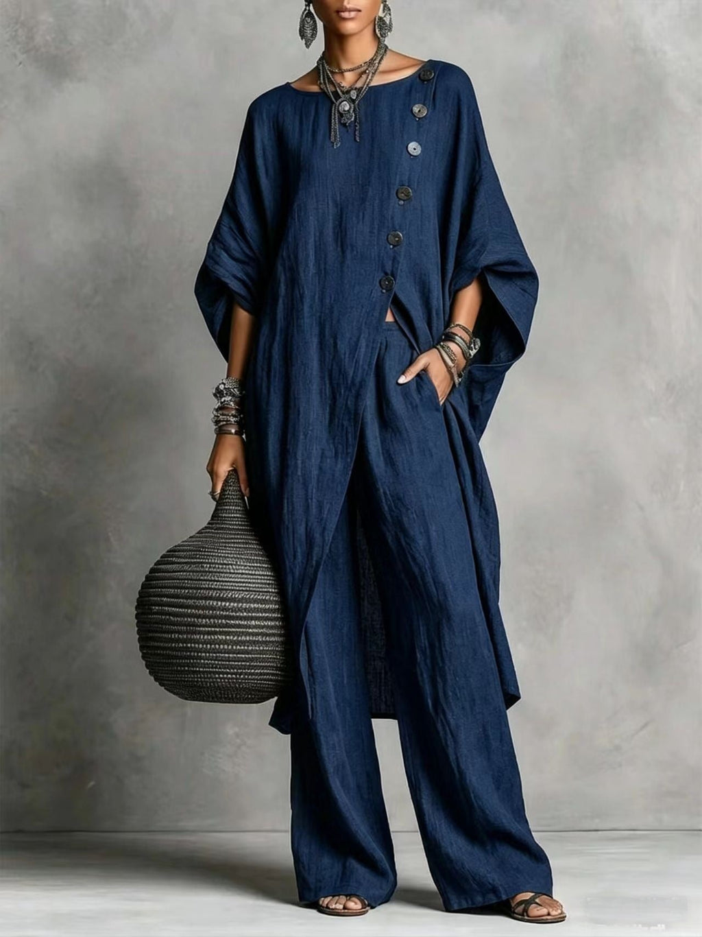 Women's casualwear set featuring a drop shoulder three-quarter sleeve irregular shirt and matching pants from Plush Fashion Hub.