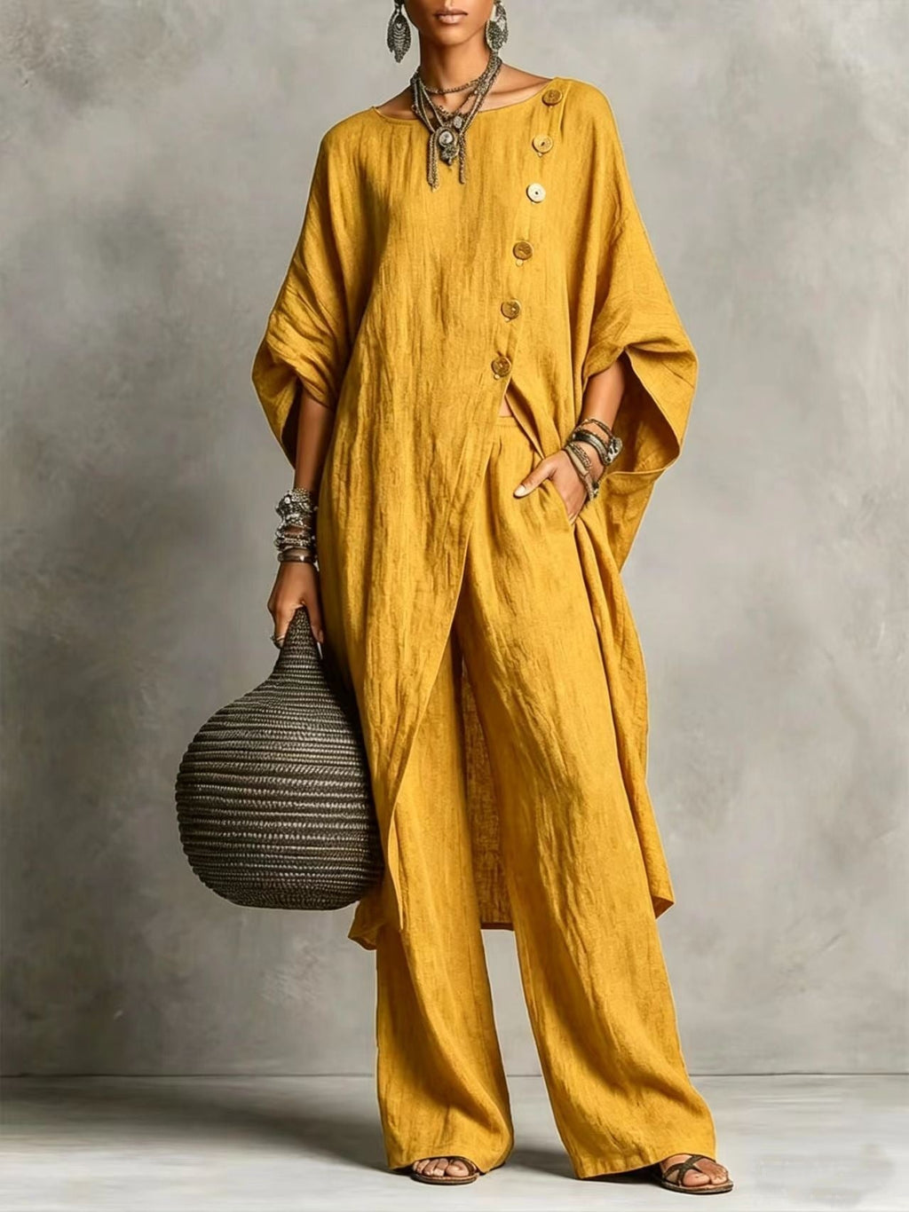 Women's casual wear set by Plush Fashion Hub featuring a drop shoulder three-quarter sleeve irregular shirt and matching pants.