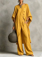 Women's casual wear set by Plush Fashion Hub featuring a drop shoulder three-quarter sleeve irregular shirt and matching pants.