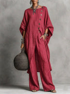Women's casual drop shoulder three-quarter sleeve irregular shirt and pants set by Plush Fashion Hub, shown on a model.