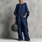 Women's casual drop shoulder three-quarter sleeve irregular shirt and pants set by Plush Fashion Hub, shown in a stylish outdoor setting.
