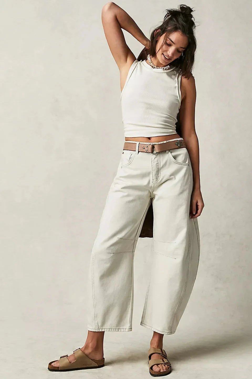 Women’s high-waisted jeans with elastic waistband, casualwear by FitiqueFit, showing front view with classic denim look.