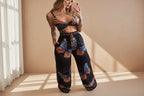 Women’s feather print crop top and pants set by Plush Fashion Hub, casual 2-piece vacation outfit with lightweight fabric.