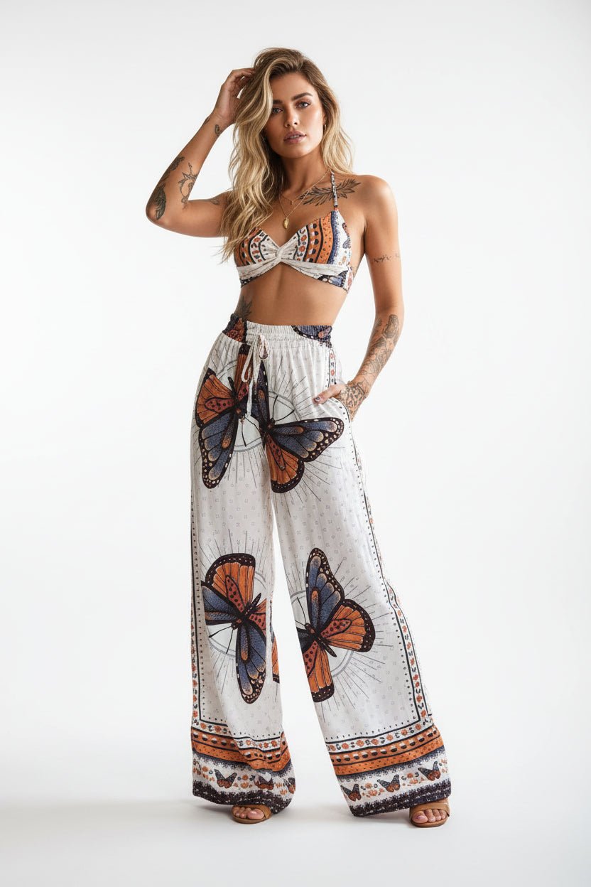 Women's feather print crop top and pants set by Plush Fashion Hub, casualwear 2-piece vacation outfit, stylish and comfortable.