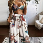 Women's feather print crop top and pants set by Plush Fashion Hub, casual 2-piece vacation outfit, stylish and comfortable.