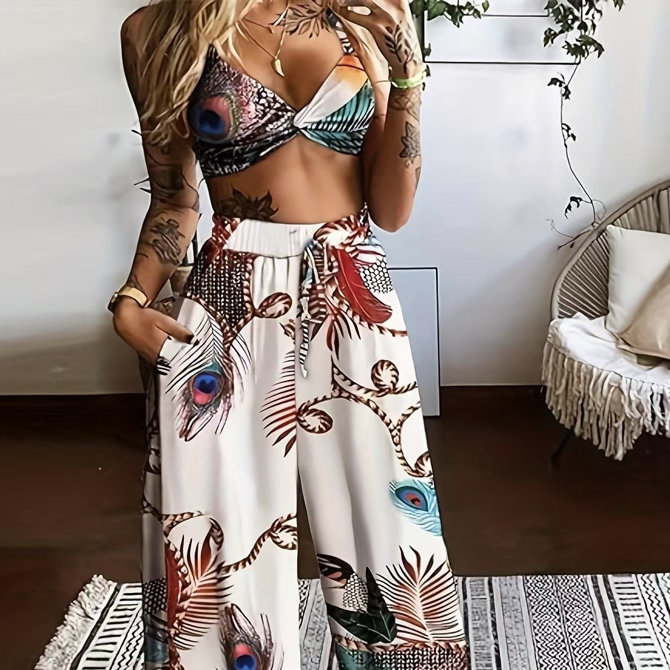Women's feather print crop top and pants set by Plush Fashion Hub, casual 2-piece vacation outfit, stylish and comfortable.
