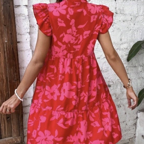 Women’s floral A-line vacation dress by Plush Fashion Hub, casualwear with a colorful floral pattern and flowing fit.
