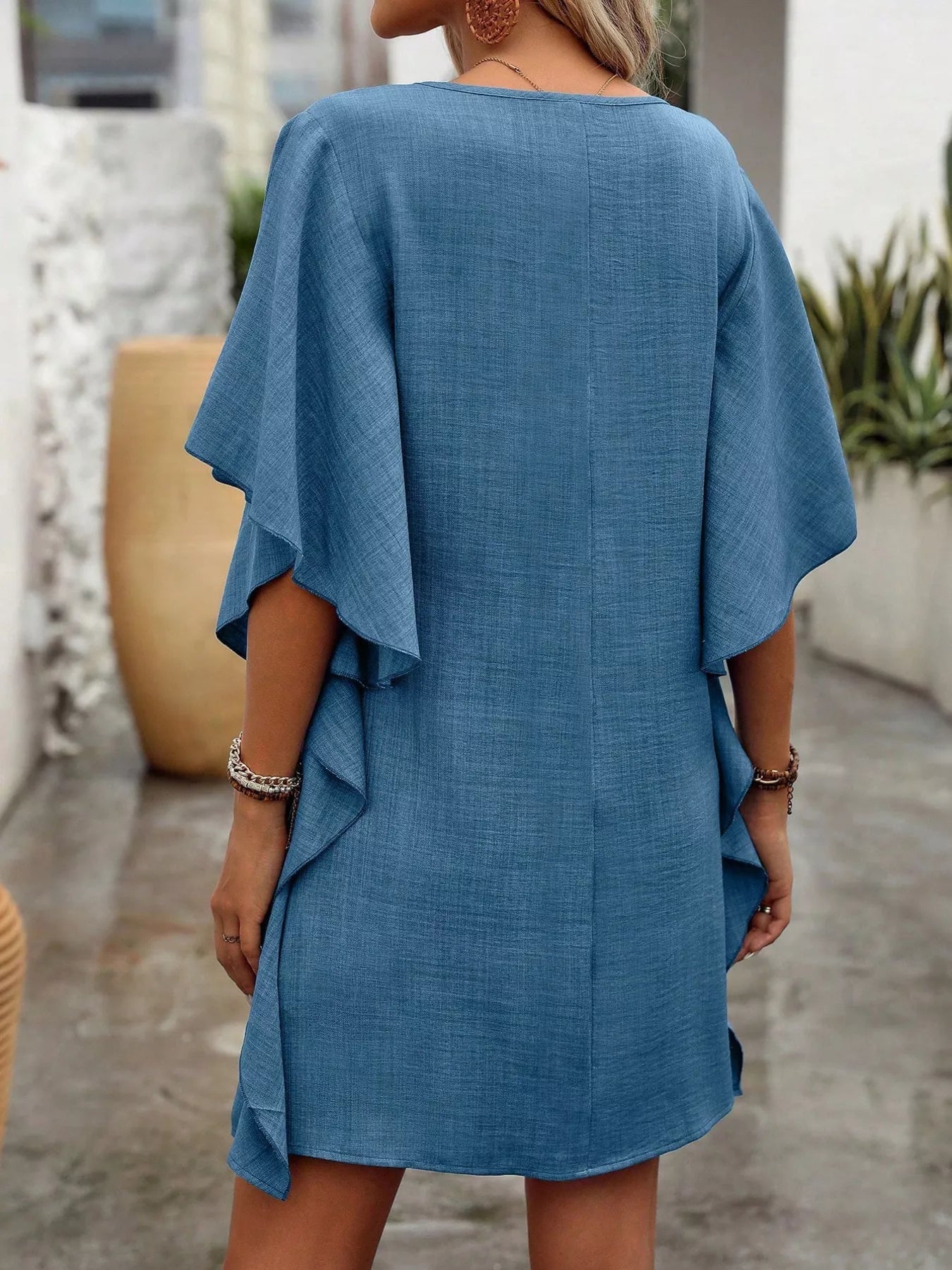 Women's flowy V-neck casual mini dress with ruffled sleeves, stylish and comfortable, perfect for everyday wear.