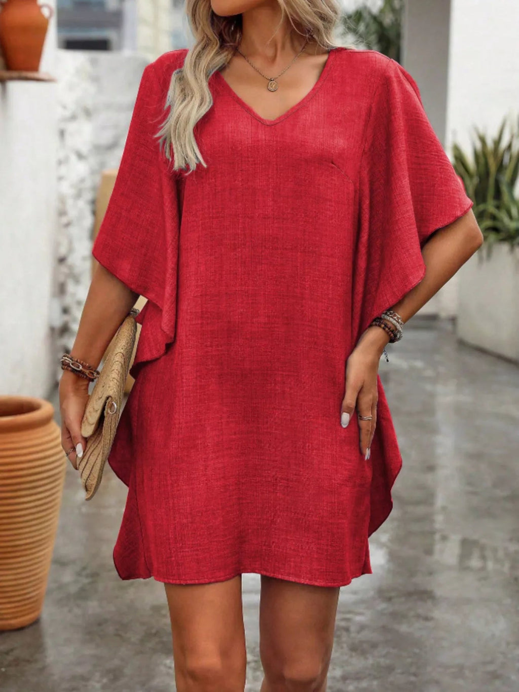 Women's flowy V-neck casual mini dress with ruffled sleeves, stylish and comfortable for everyday wear.