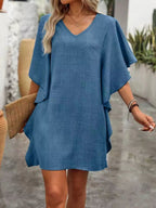 Women's flowy V-neck casual mini dress with ruffled sleeves by Trendsi, featuring a relaxed fit and stylish ruffle detailing.