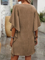 Women's flowy V-neck casual mini dress with ruffled sleeves, from Trendsi, featuring lightweight fabric and relaxed fit.