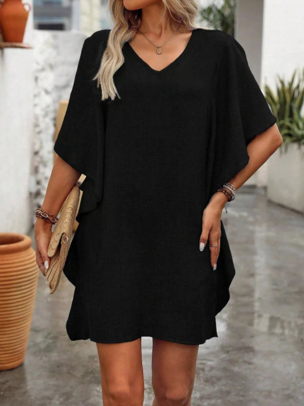 Women's flowy V-neck casual mini dress with ruffled sleeves, stylish and comfortable for everyday wear.