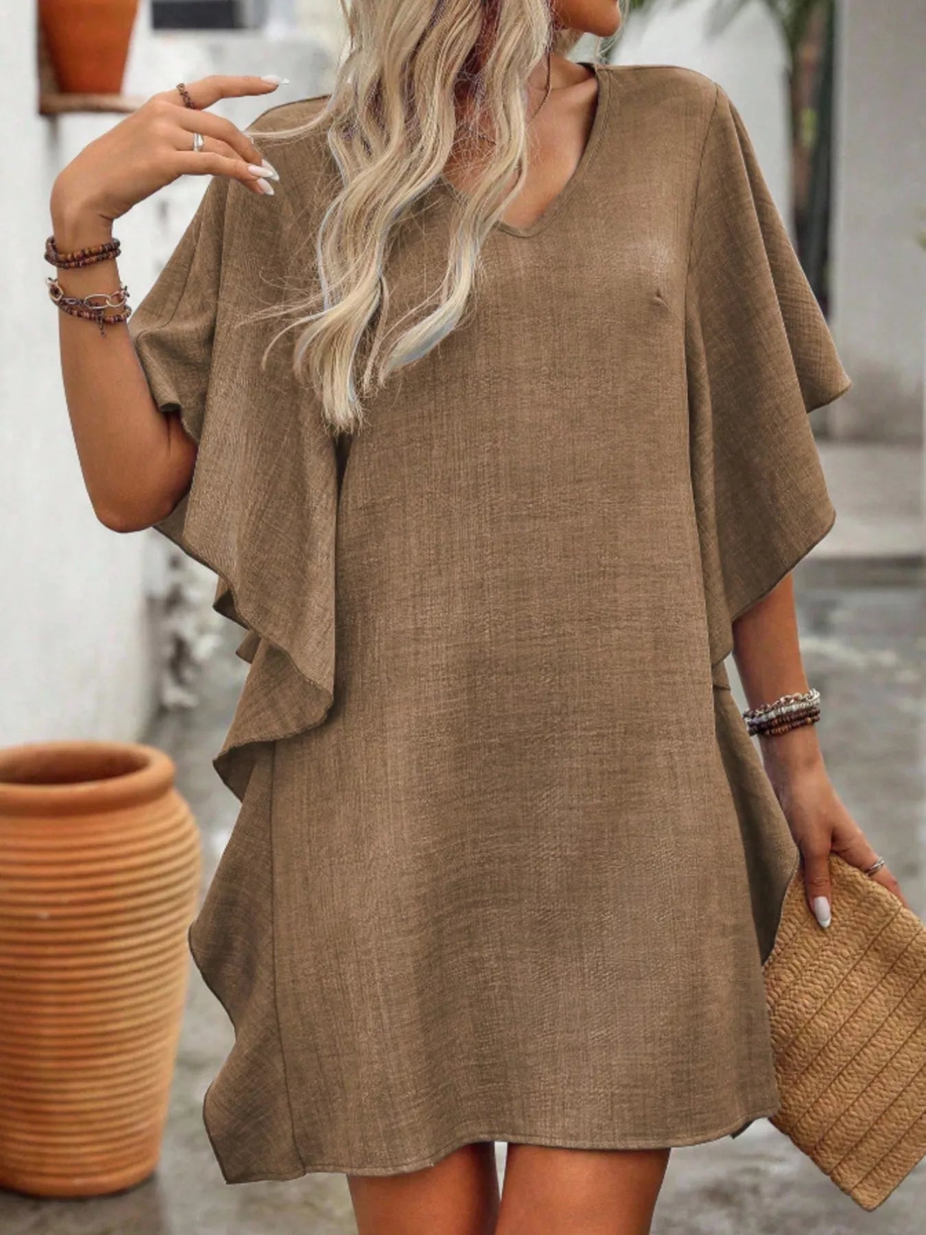 Women's flowy V-neck casual mini dress with ruffled sleeves, stylish and comfortable, from Trendsi.
