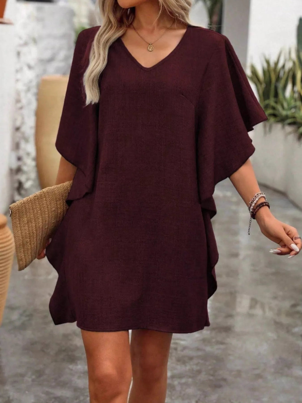 Women's flowy V-neck casual mini dress with ruffled sleeves, stylish and comfortable for everyday wear, by Trendsi.