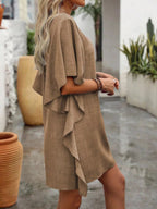 Women's flowy V-neck casual mini dress with ruffled sleeves, stylish and comfortable, made by Trendsi.