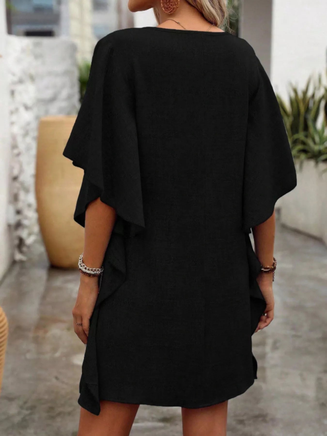 Women's flowy V-neck casual mini dress with ruffled sleeves, stylish and comfortable, perfect for everyday wear.
