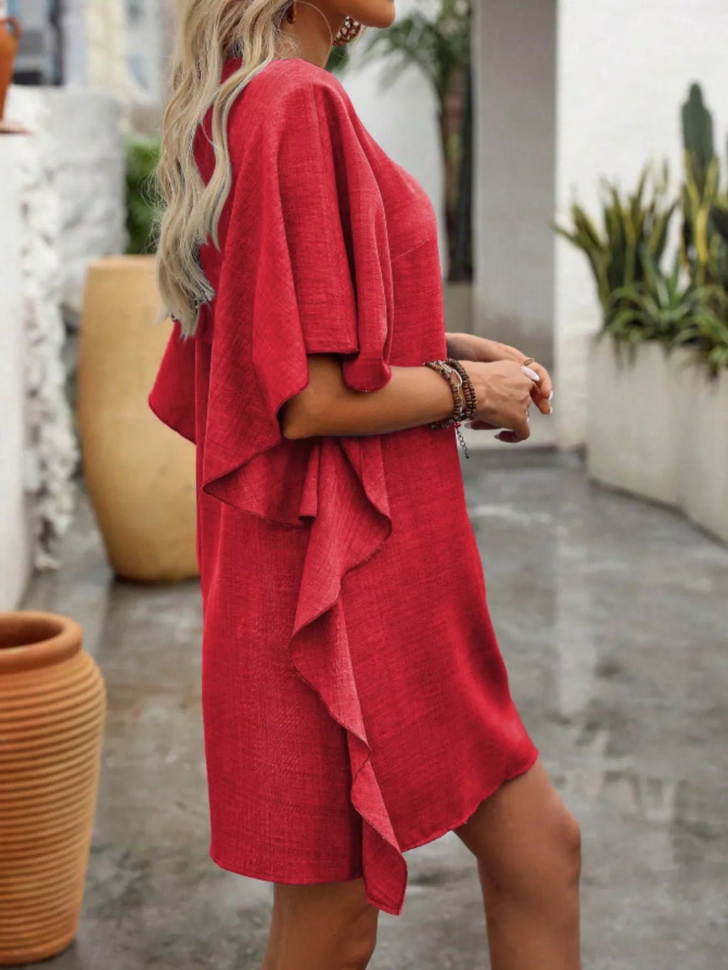 Women's flowy V-neck casual mini dress with ruffled sleeves, stylish and comfortable for everyday wear.