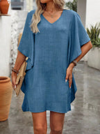 Women's flowy V-neck casual mini dress with ruffled sleeves by Trendsi, featuring a relaxed fit and stylish design.