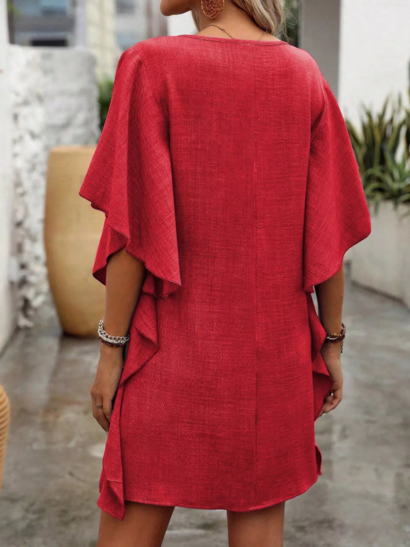 Women's flowy V-neck casual mini dress with ruffled sleeves, stylish and comfortable for everyday wear.
