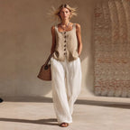 Women's sleeveless front-button cardigan and long pants set in casualwear style by Plush Fashion Hub, shown in natural light.