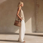 Women's sleeveless cardigan and long pants set by Plush Fashion Hub, casualwear with front buttons and comfortable fit.