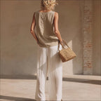 Women's sleeveless button-front cardigan and long pants set in casualwear style by Plush Fashion Hub.