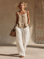 Women's sleeveless cardigan top and long pants set in casualwear style by Plush Fashion Hub, featuring front buttons and comfortable fit.