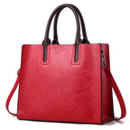 Elegant women's handbag by Plush Fashion Hub featuring a sleek design with a top handle and stylish accents.