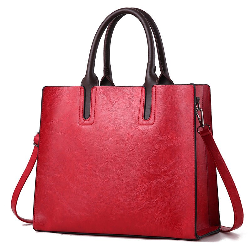 Elegant women's handbag by Plush Fashion Hub featuring a sleek design with a top handle and stylish accents.