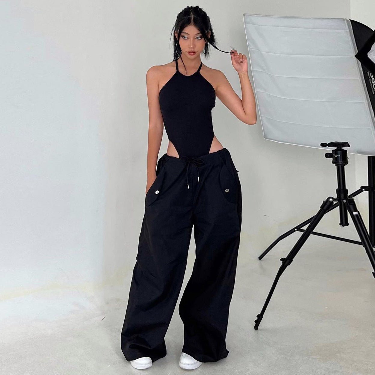 Women’s high-waist lace-up straight-leg cargo pants in loose fit, casualwear by Plush Fashion Hub, shown in neutral color with functional pockets.