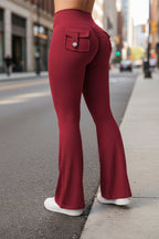 Black women's high-waisted cargo pocket workout leggings from Plush Fashion Hub, featuring a comfortable fit and functional pockets.