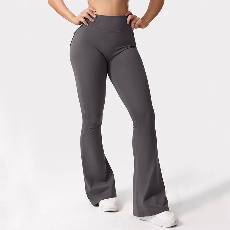 Black high-waisted women's workout leggings with cargo pockets from Plush Fashion Hub, designed for casualwear and active use.