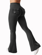 Black women's high-waisted cargo pocket workout leggings by Plush Fashion Hub, shown on a model with a casual fit.