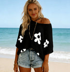 Women's hollow-out drop-shoulder loose knit top by Plush Fashion Hub, casualwear with open shoulder design and relaxed fit.
