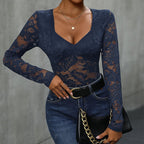 Women’s lace long sleeve bodysuit with deep V neck, solid casualwear top by Plush Fashion Hub, shown on a model.