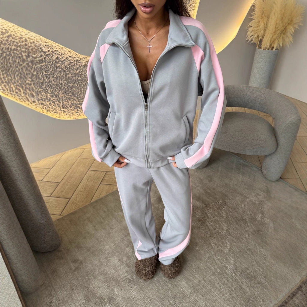 Women’s long-sleeve zip-up jacket and sweatpants two-piece set from Plush Fashion Hub, shown on a model in casual wear.