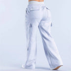 Women's loose-fit casual pants with pockets in solid two-tone color, by Plush Fashion Hub, displayed in a relaxed fit.