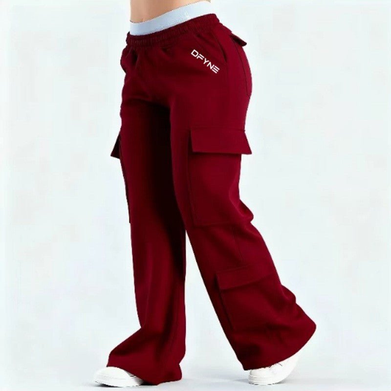 Women's loose-fit casual pants with pockets in solid two-tone color by Plush Fashion Hub, shown in a relaxed fit style.