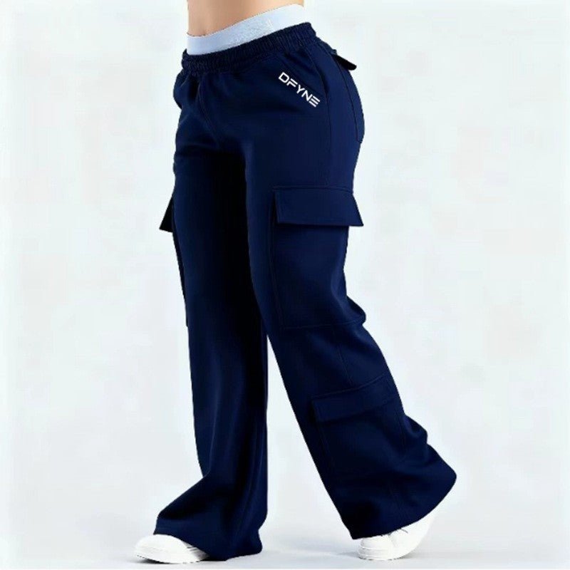 Women's loose-fit casual pants with pockets in solid two-tone color, made by Plush Fashion Hub, perfect for comfortable everyday wear.