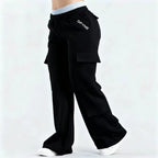 Women's loose-fit casual pants with pockets in a solid two-tone color, featuring a Plush Fashion Hub label.