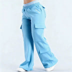 Women's loose-fit casual pants with pockets, solid color, two-tone design, by Plush Fashion Hub, shown on a model.