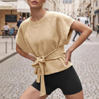 Women's casual short-sleeve top with loose fit, round neck, lace-up detail, and bow-knot accent by Plush Fashion Hub.