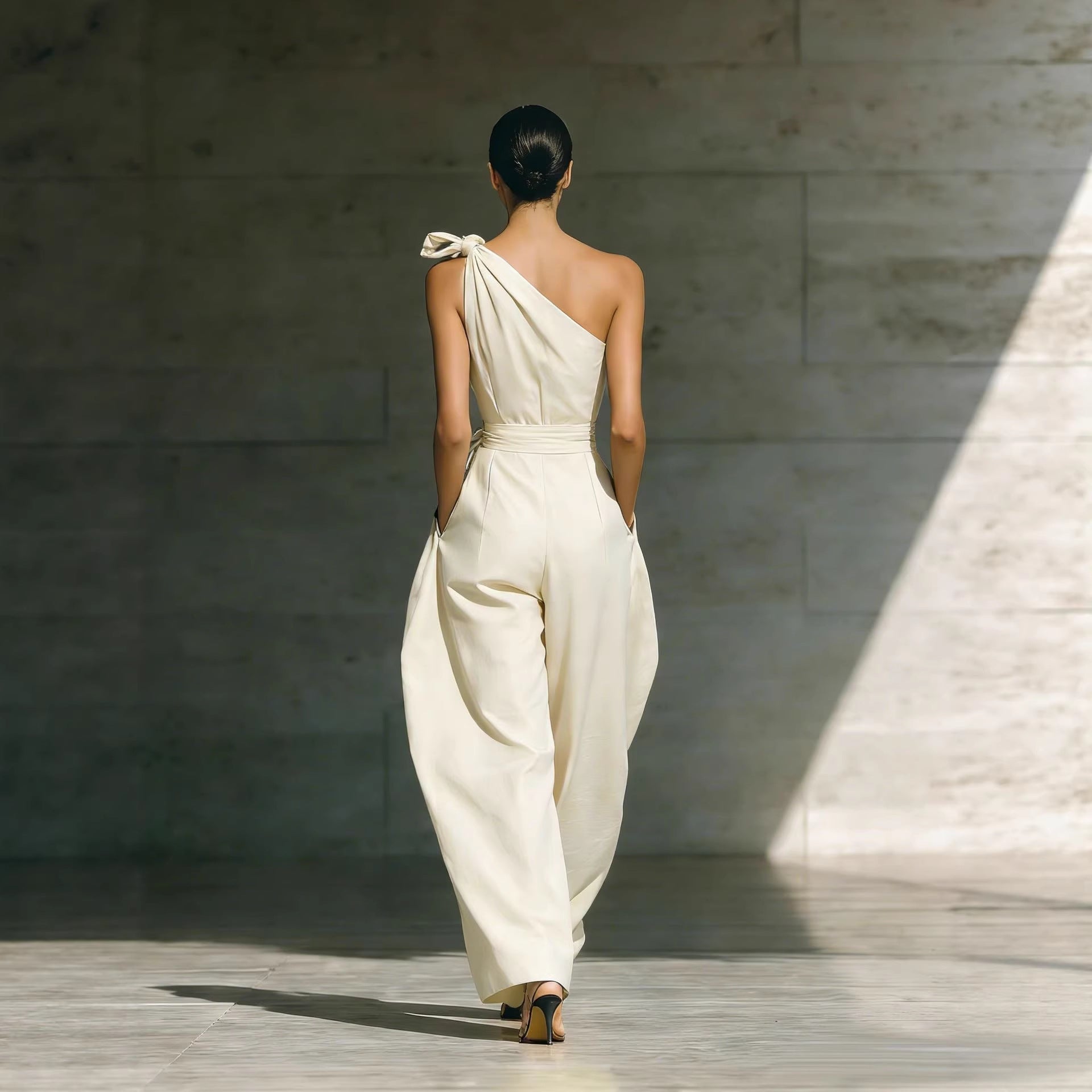 Women's loose, sleeveless off-shoulder jumpsuit with belt and wide-leg design, casualwear from Plush Fashion Hub.
